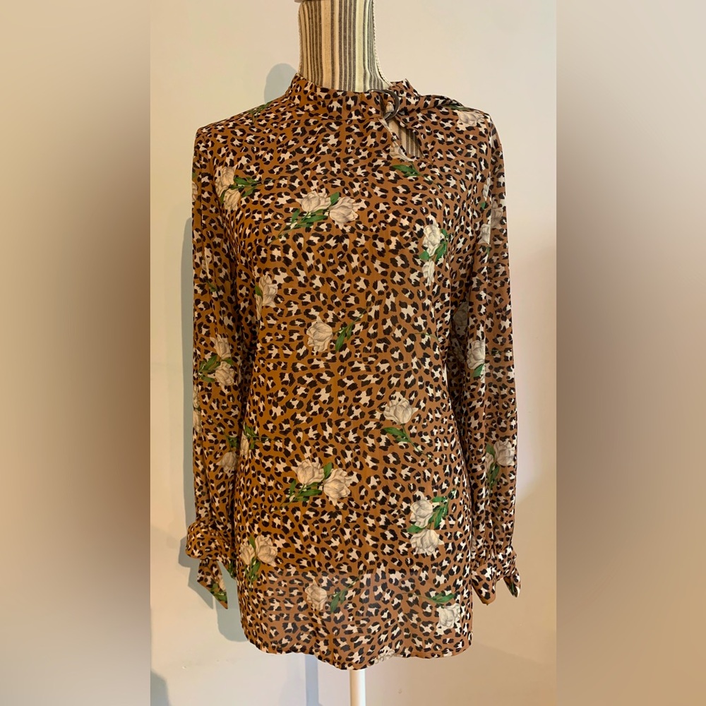Eloqui leopard print top with notched collar.